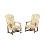 A PAIR OF WALNUT AND UPHOLSTERED OPEN ARMCHAIRS