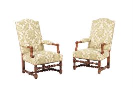 A PAIR OF WALNUT AND UPHOLSTERED OPEN ARMCHAIRS