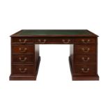 A MAHOGANY PEDESTAL DESK IN GEORGE III STYLE