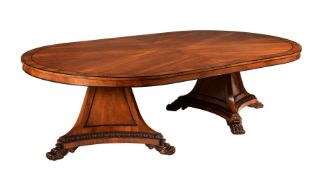 A MAHOGANY TWIN PEDESTAL OVAL DINING TABLE IN GEORGE IV STYLE