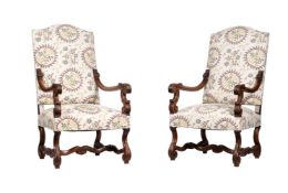 A PAIR OF CARVED WALNUT AND UPHOLSTERED OPEN ARMCHAIRS IN LOUIS XIV STYLE