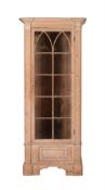 A DISTRESSED LIMED PINE DISPLAY CABINET