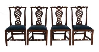 A SET OF FOUR GEORGE III MAHOGANY SIDE CHAIRS, POSSIBLY IRISH