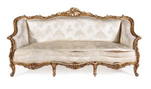 A FRENCH CARVED GILTWOOD SOFA IN LOUIS XVI STYLE