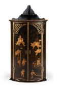 A BLACK LACQUERED HANGING CORNER CUPBOARD