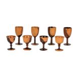 A GROUP OF EIGHT LIGNUM VITAE GOBLETS