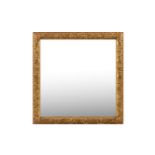 A CARVED GILTWOOD FRAMED WALL MIRROR