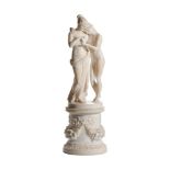 A SCULPTED ALABASTER GROUP OF TWO MAIDENS