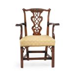 A GEORGE III CARVED MAHOGANY ARMCHAIR