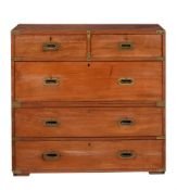 A TEAK CAMPAIGN CHEST OF DRAWERS