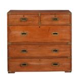 A TEAK CAMPAIGN CHEST OF DRAWERS