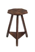 AN OAK OCTAGONAL TWO TIER OCCASIONAL TABLE