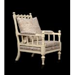 A CREAM PAINTED AND UPHOLSTERED ARMCHAIR, IN VICTORIAN 'GOTHIC REVIVAL' TASTE