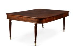A REGENCY MAHOGANY CAMPAIGN EXTENDING DINING TABLE IN THE MANNER OF GILLOWS
