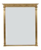 A VICTORIAN GILTWOOD AND COMPOSITION WALL MIRROR