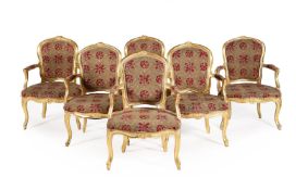 A SET OF SIX GEORGE III GILTWOOD AND TAPESTRY UPHOLSTERED ARMCHAIRS IN LOUIS XV STYLE