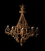 A CONTINENTAL YELLOW PAINTED WROUGHT IRON TEN LIGHT CHANDELIER