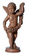 A COLD PAINTED TERRACOTTA MODEL OF A PUTTO