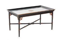 JULIAN CHICHESTER, AN EBONISED AND PARCEL GILT LOW CENTRE TABLE IN REGENCY TASTE