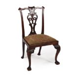 A GEORGE II CARVED MAHOGANY SIDECHAIR