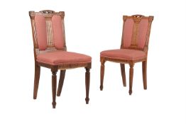 A SET OF NINE LATE VICTORIAN OAK DINING CHAIRS