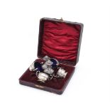 A CASED SET OF FOUR EDWARDIAN SILVER TWIN HANDLED SALTS