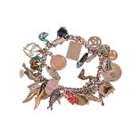 A MID 20TH CENTURY GOLD COLOURED CHARM BRACELET