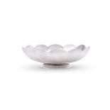 AN AMERICAN SILVER COLOURED SCALLOP SHAPED BOWL
