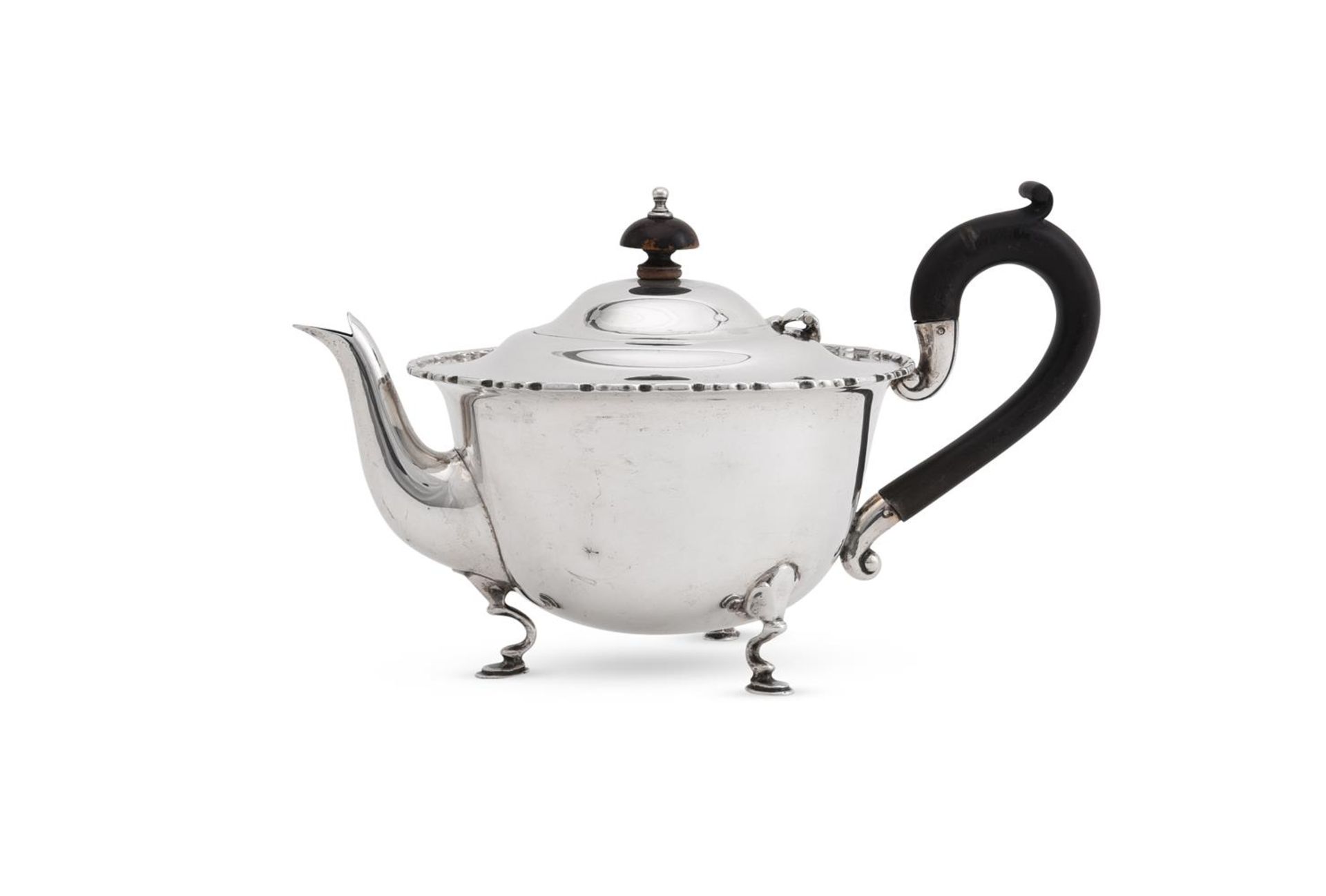 A SILVER CIRCULAR TEA POT, MAPPIN & WEBB LTD.