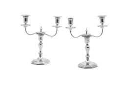A MATCHED PAIR OF EDWARDIAN SILVER TWO BRANCH CANDELABRA