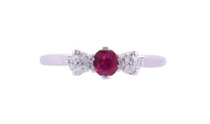 A RUBY AND DIAMOND THREE STONE RING