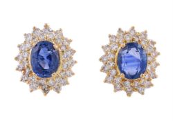 A PAIR OF DIAMOND AND SAPPHIRE CLUSTER EAR STUDS