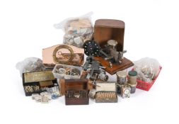 A COLLECTION OF WATCH PARTS AND TOOLS