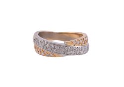 A TWO COLOUR GOLD CROSSOVER DIAMOND RING