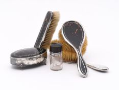 Y A SET OF THREE SILVER MOUNTED AND TORTOISESHELL DRESSING TABLE BRUSHES, MAPPIN & WEBB