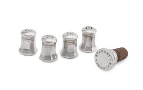 A CASED SET OF FOUR SILVER COLOURED OCTAGONAL BALUSTER PEPPERETTES, CARTIER