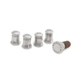 A CASED SET OF FOUR SILVER COLOURED OCTAGONAL BALUSTER PEPPERETTES, CARTIER