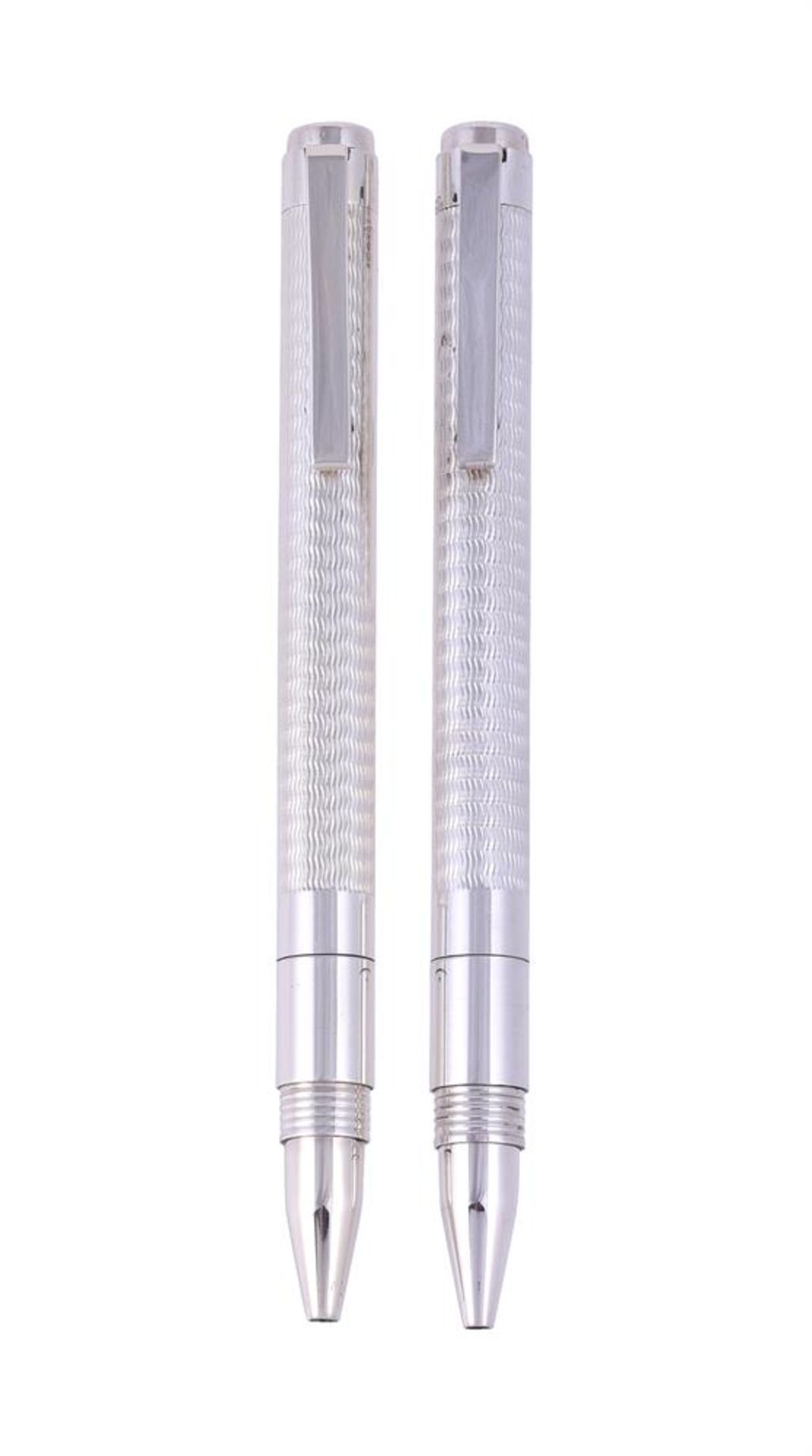 † A PAIR OF SILVER BALLPOINT PENS