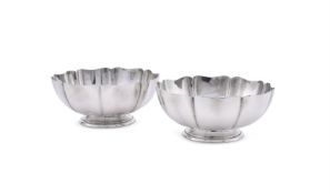 A PAIR OF AMERICAN SILVER COLOURED STANDISH BOWLS