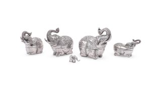 FOUR SILVER COLOURED ELEPHANT BOXES