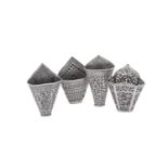 FOUR SILVER COLOURED BETEL LEAF HOLDERS