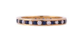 AN 18 CARAT GOLD SAPPHIRE AND DIAMOND ETERNITY RING, LONDON 2014