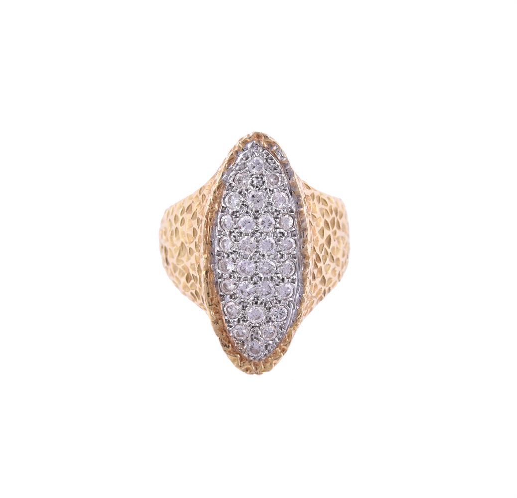 A DIAMOND NAVETTE SHAPED PANEL DRESS RING