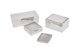 THREE SILVER MOUNTED CIGARETTE BOXES AND A CIGARETTE CASE