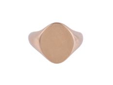 A GOLD COLOURED SIGNET RING