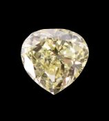 † AN UNMOUNTED FANCY LIGHT YELLOW DIAMOND