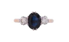 A SAPPHIRE AND DIAMOND THREE STONE RING