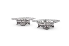 A PAIR OF AMERICAN SILVER COLOURED PIERCED SHAPED CIRCULAR DISHES