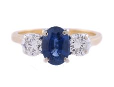 A SAPPHIRE AND DIAMOND THREE STONE RING