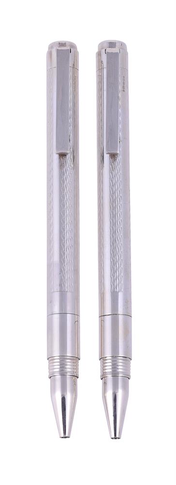 † A PAIR OF SILVER BALLPOINT PENS